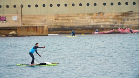 Man doing Paddle surf in Barcelona. Collecting garbage Cleaning the Environment 스톡 동영상 117127746