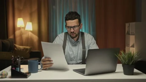 A man doing paper work at home Video stock 160104136