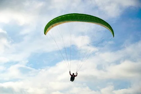 Man doing Para-glider in the clouded sky. Man doing sport, Para-glider in ... 写真素材