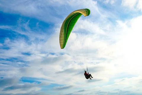 Man doing Para-glider in the clouded sky. Man doing sport, Para-glider in ... 写真素材