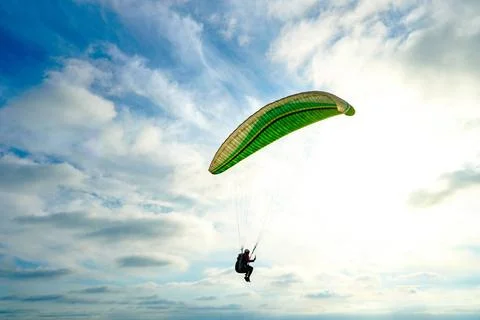 Man doing Para-glider in the clouded sky. Man doing sport, Para-glider in ... 写真素材