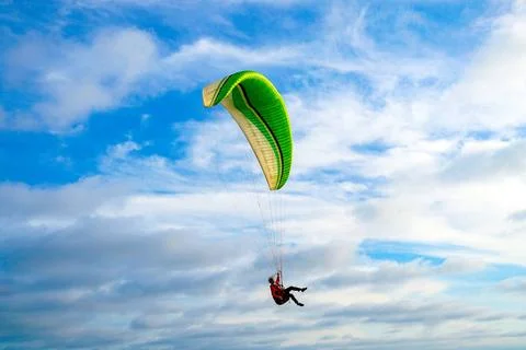 Man doing Para-glider in the clouded sky. Man doing sport, Para-glider in ... 写真素材