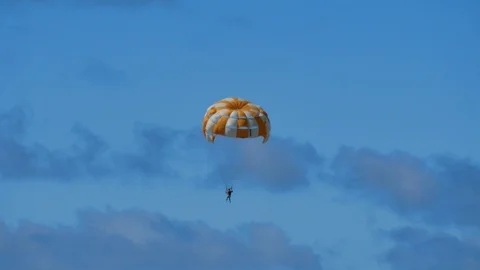 A man doing parasiling with no hands for a moment Stock Footage 114604379