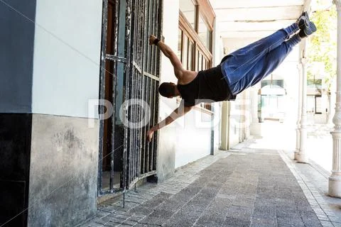 Man doing parkour in the city Stock Photos