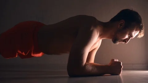 Man doing plank exercise at home Stock Footage 121323312