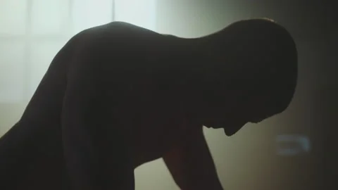 Man doing plank posture exercise on tyre Stock Footage 236183186