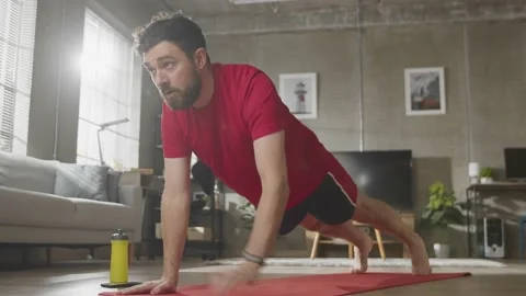 Man doing Plank on Yoga Mat at Home. sport, fitness and healthy lifestyle Stock Footage 169016922