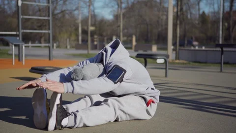 Man doing post-workout cool down stretch Stock Footage 129690168