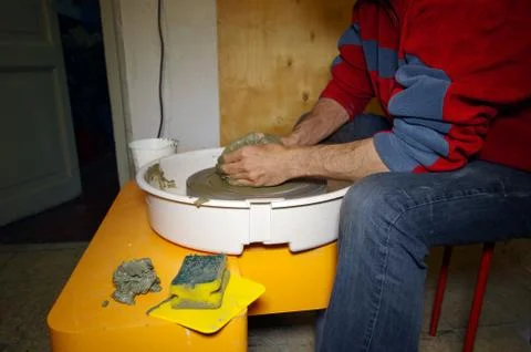 Man doing pottery work Stock Photos