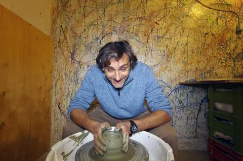 Man doing pottery work Stock Photos