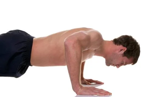 Man doing a press up isolated Stock Photos