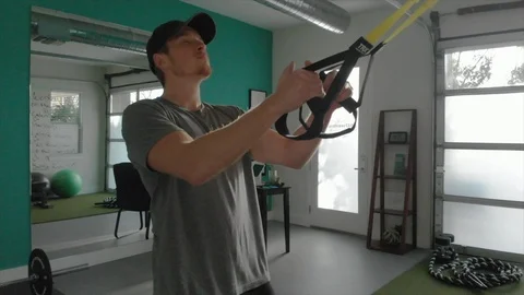 Man doing pull up with TR-x cable exercise Stock Footage 90828709