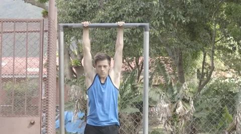 Man Doing Pull-ups with Extended Legs Stock Footage 60259567