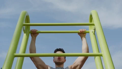 Man doing pull-ups Stock Footage 100028528