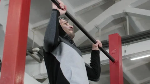 Man doing pull ups in gym, strength training Stock Footage 329187087