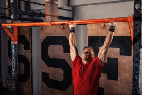Man doing pull ups Stock Photos
