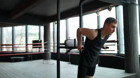 Man Doing Pulling Up At the Gym 库存影片 103757050