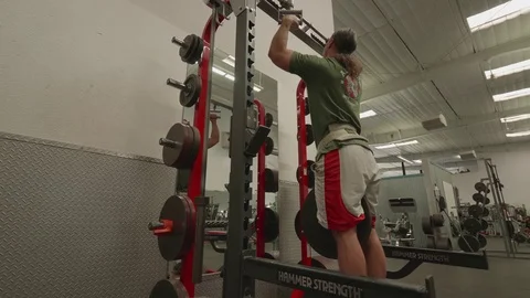 Man doing Pullups with Weights Attached to Waist Stock Footage 80009134