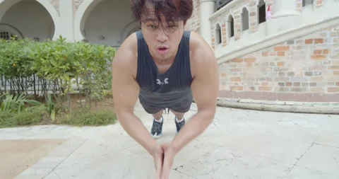 A man doing push up - low angle Stock Footage 146096537