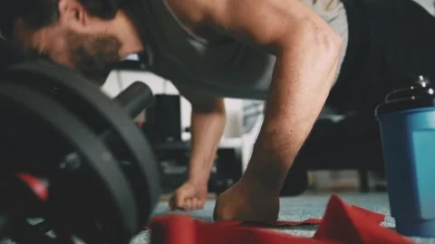 Man is doing push-ups at home in living room. Footage HD. Stock Footage 147872300