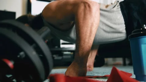 Man is doing push-ups at home gym. Footage HD. Stock Footage 147872301