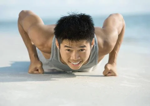 Man doing push-ups on knuckles Stock Photos