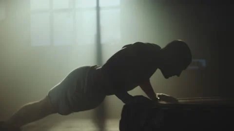 Man doing push-ups over a large tyre Video stock 236182989