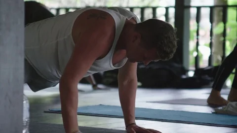Man doing push-ups in yoga classes Stock-Footage 74778344