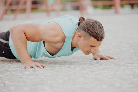 Man doing pushups exercise outdoors Stock Photos