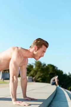 Man Doing Pushups Outdoors Stock Photos