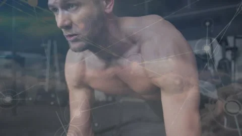 Man doing pushups, starting lowering chest for fitness, network overlay tracking Stock Footage 330917503