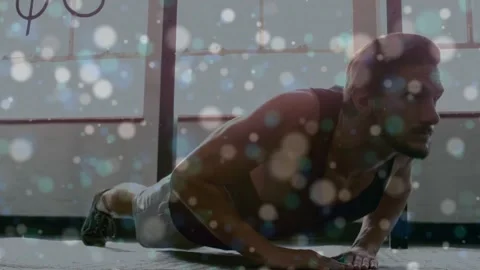 Man doing pushups on textured mat starting low rising, animated flares showing Stock Footage 333911336
