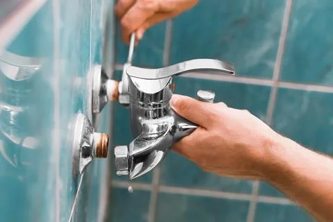 A man is doing repairs during a home renovation. This handyman and homeowne.. Stockfoto's