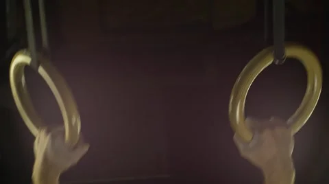 Man doing ring dips (BMCC 2.5K - 2400x1350) Stock Footage 47986673