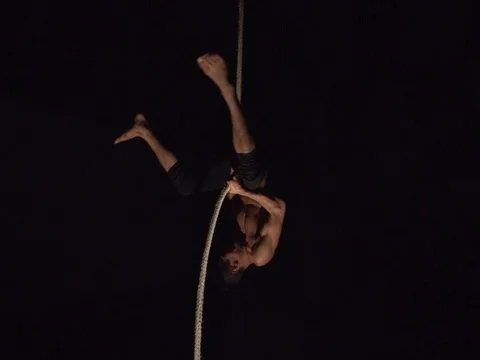 Man Doing Rope Drop Circus Trick Stock Footage 80164504