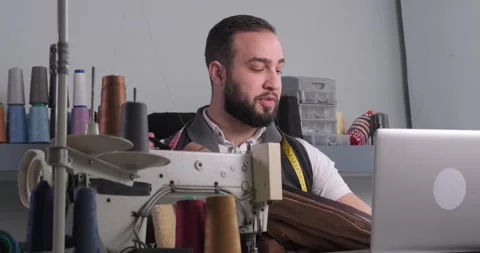 Man doing sewing courses online Stock Footage 165827236