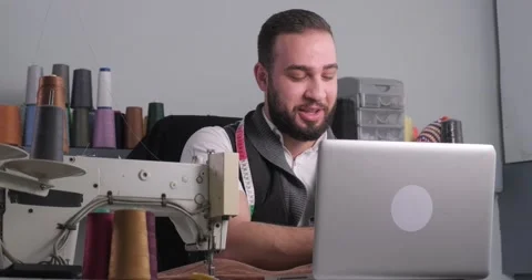 Man doing sewing courses online Stock Footage 165827447