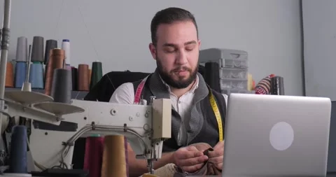 Man doing sewing courses online Stock Footage 165827752