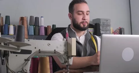 Man doing sewing courses online Stock Footage 165827943