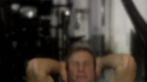 A man doing sit-ups at a gym, Sweden. Stockbeeldmateriaal 51856463