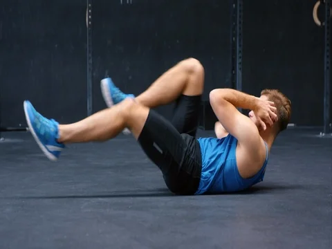 Man Doing Sit-Ups In Gym Stock Footage 75038923