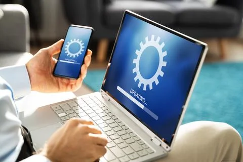 Man Doing Software Update On Mobile Phone Foto stock
