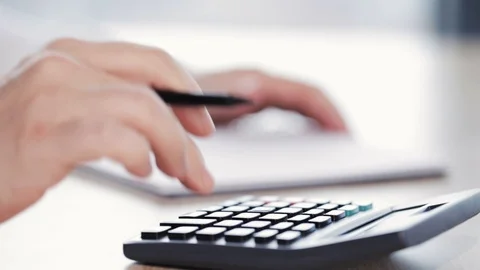 A man doing some calculations Video stock 97238830