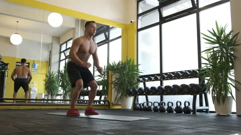Man Doing Squat In GYM 4K Video Stock Footage 144256785