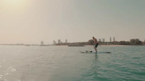 Man doing stand up paddle boarding Video stock 131086459
