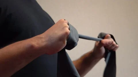 Man doing strength exercises with band 4K Stock-Footage 205569242