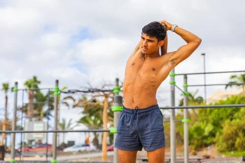 A man is doing a stretching exercise during his workout, healthy lifestyle Stock Photos