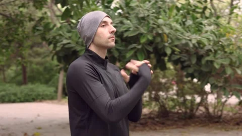 Man doing stretching exercises for arms Stock Footage 132050484