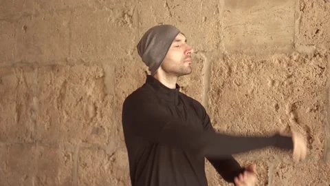 Man doing stretching exercises for arms outdoors Stock Footage 132051750