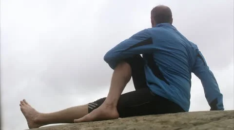 Man doing stretching exercises Stock Footage 11340505